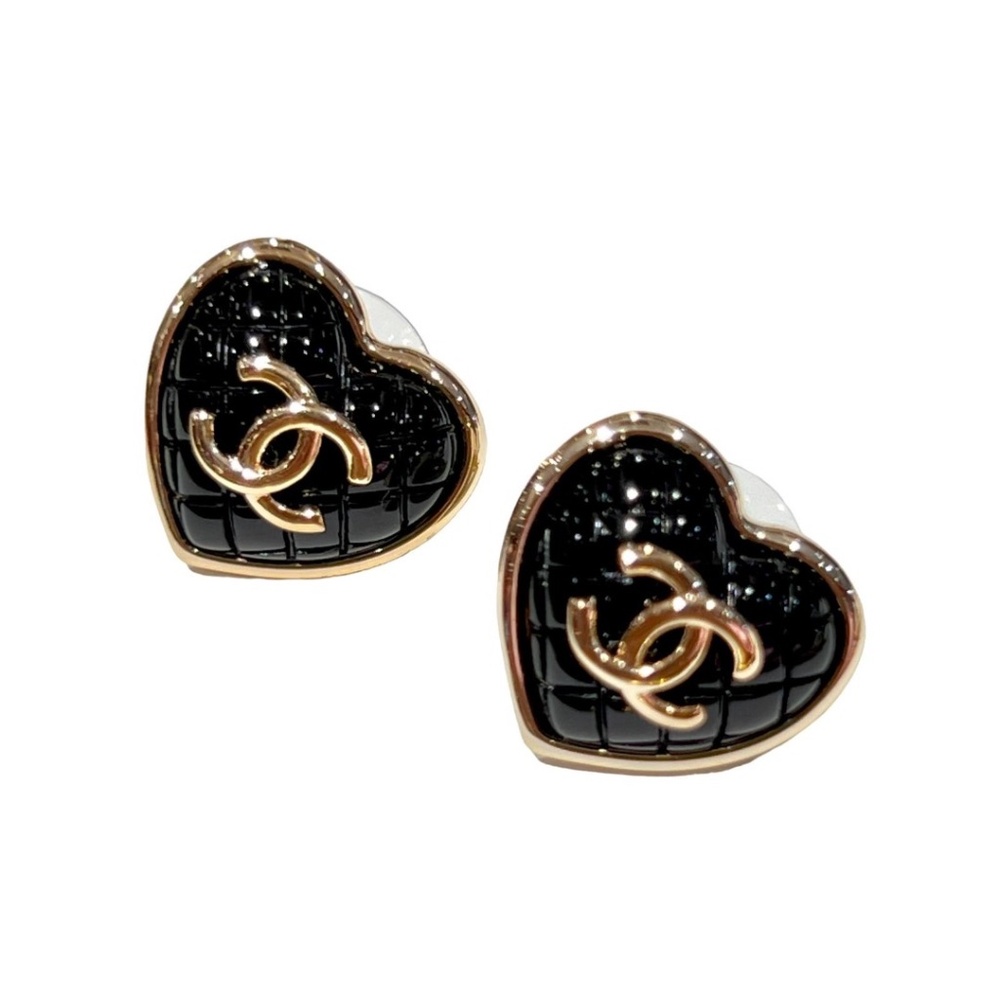Black textured heart shaped studs with twin C motif in golden finish